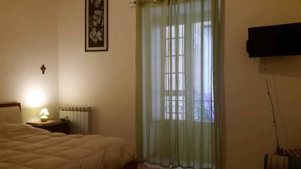 Ένα ή περισσότερα κρεβάτια σε δωμάτιο στο Ai Baretti B&B