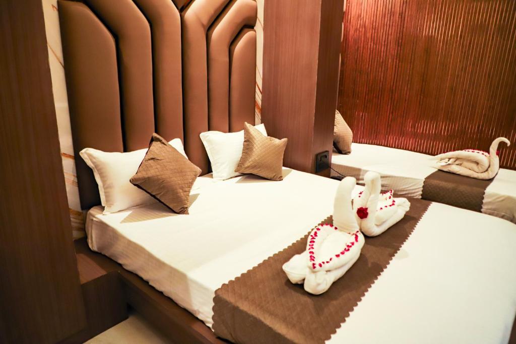 Ένα ή περισσότερα κρεβάτια σε δωμάτιο στο Hotel MakeSure