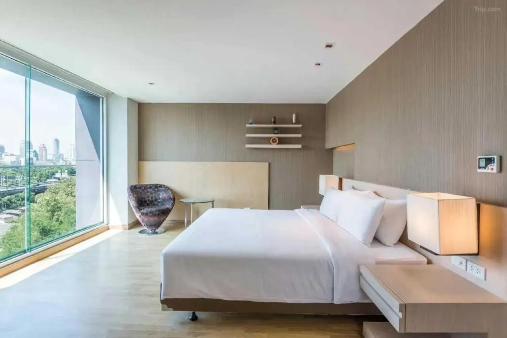 Ένα ή περισσότερα κρεβάτια σε δωμάτιο στο Palette Hi Hotel Bangkok