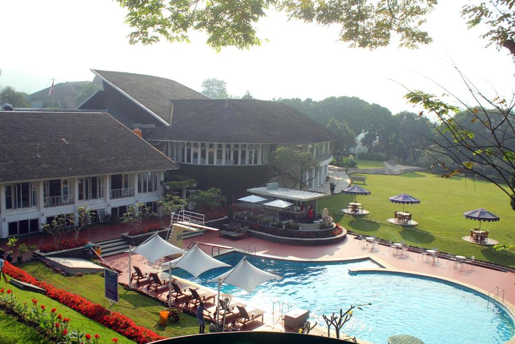 an aerial view of a resort with a swimming pool at Concordia Hotel Bumi Sangkuriang Bandung in Bandung