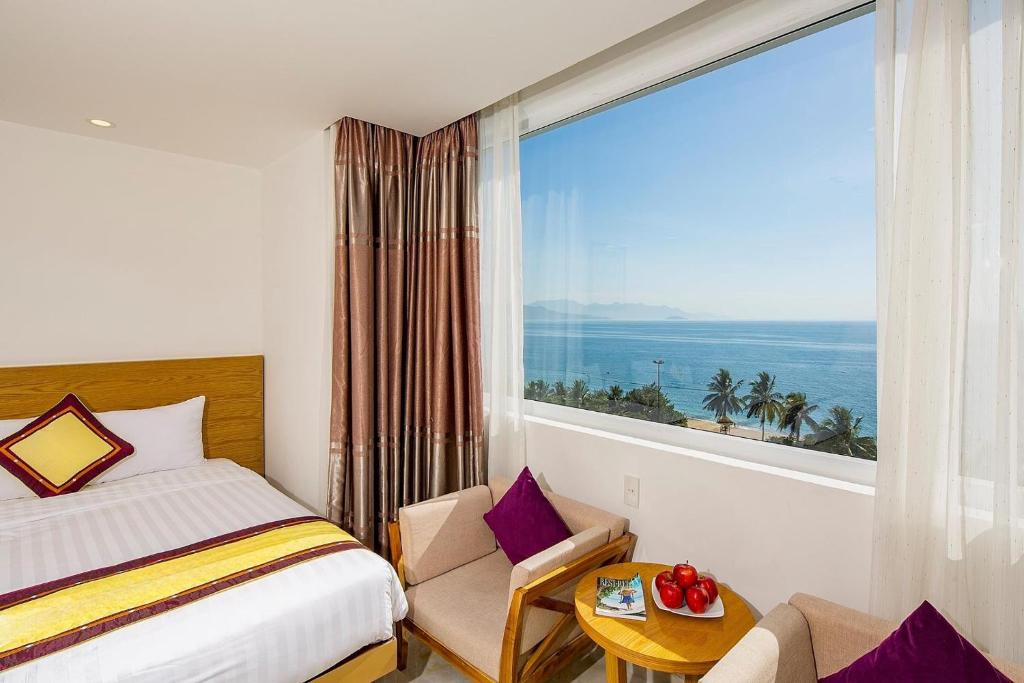 En eller flere senge i et værelse på Soria Majestic Beachfront Hotel