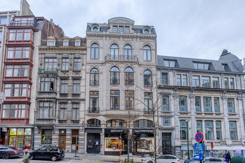 a large building on the corner of a street at Maison Lombard by Reside in Brussels