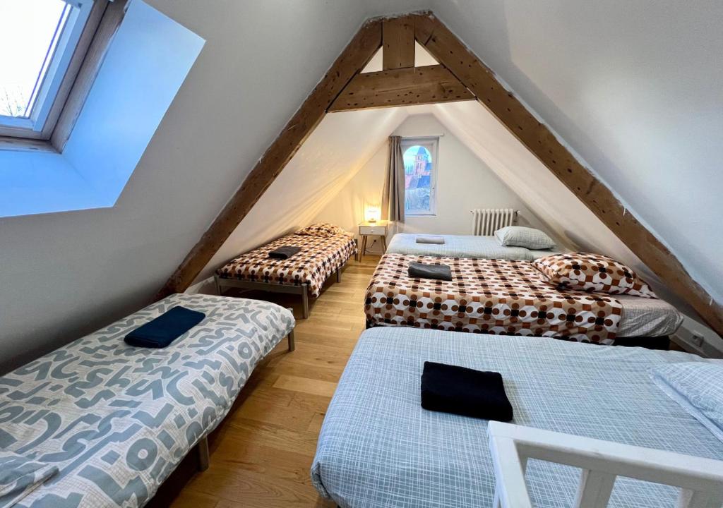 Ένα ή περισσότερα κρεβάτια σε δωμάτιο στο La Villa Madeleine -jacuzzi - 10 voyageurs