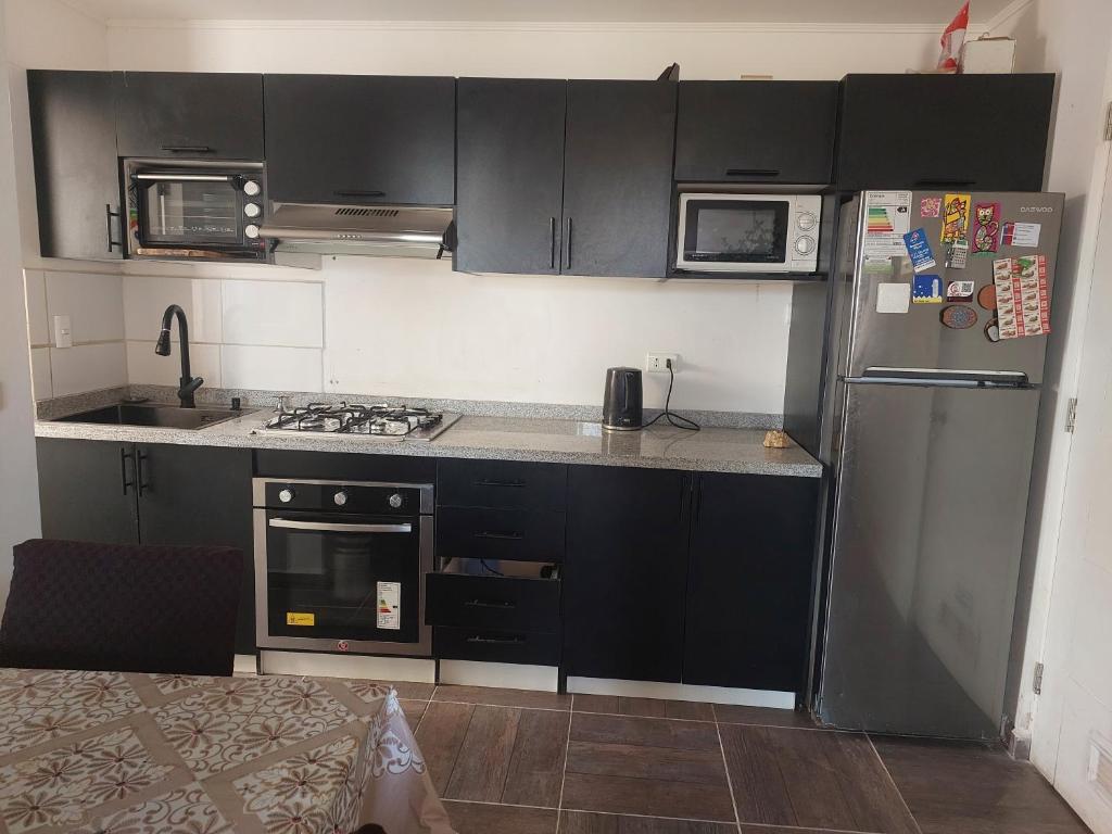 Køkken eller tekøkken på Depto cerca playa