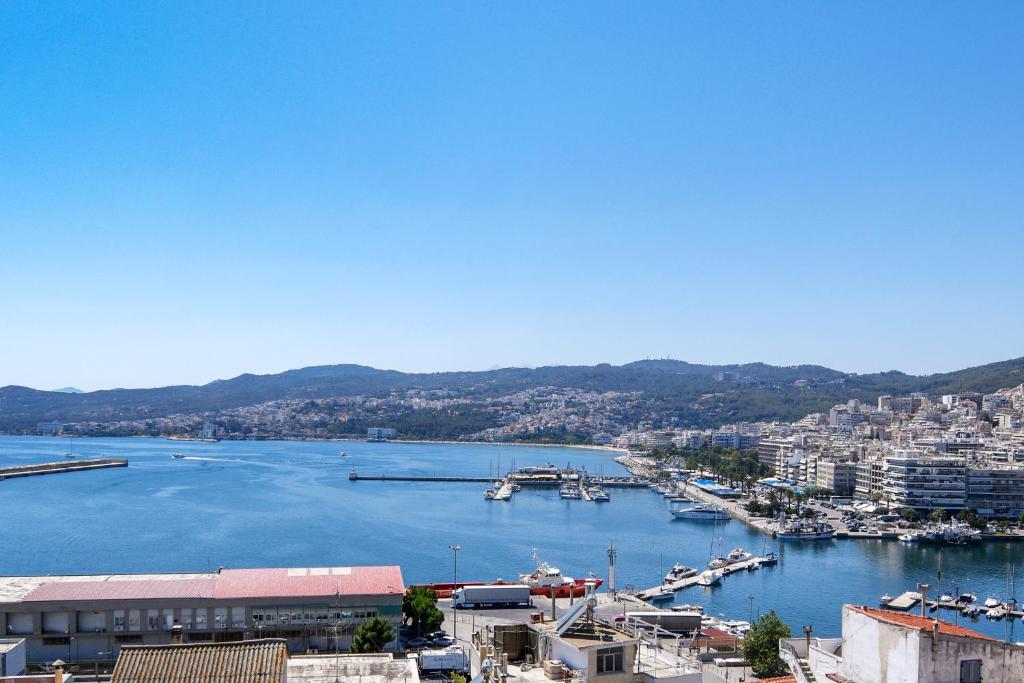 a view of a harbor with boats in the water at ISTIO apartments in Kavála