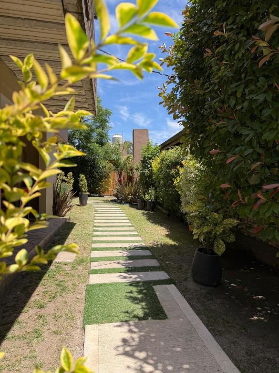 a garden with plants and a walkway at CABAÑAS MECHI in Mar del Plata