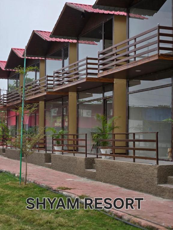 a building with balconies on the side of it at Shyam Resort in Khandwa