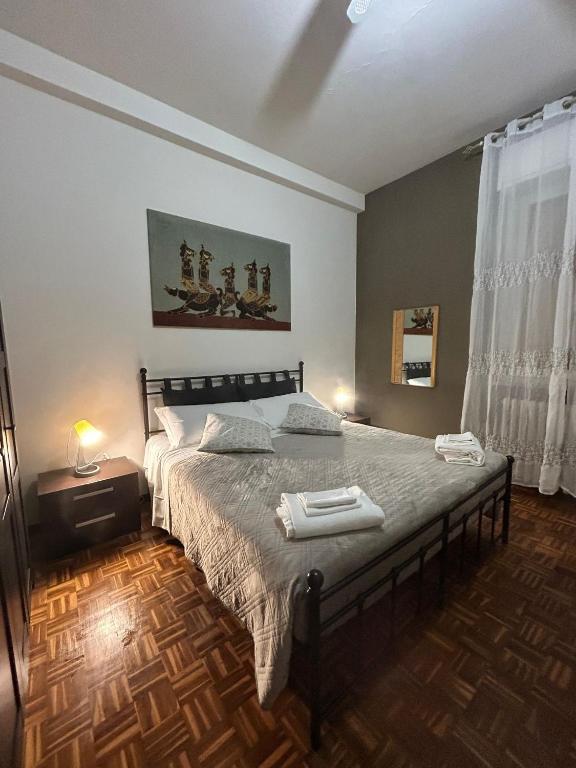 a bedroom with a bed with two towels on it at Alloggio Desiri 2 in Pavia