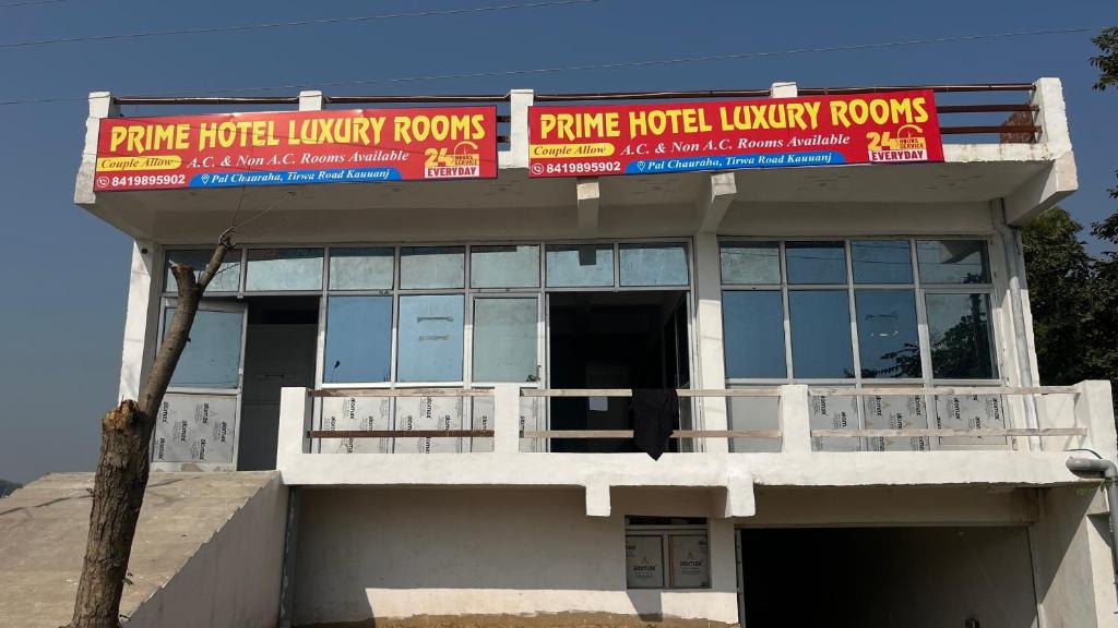 a building with signs on the top of it at Prime Hotel in Kannauj