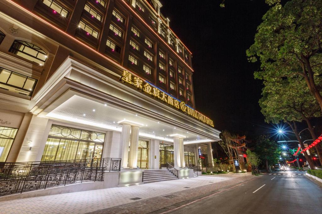 a building on a city street at night at Royal Gold Hotel in Kaohsiung