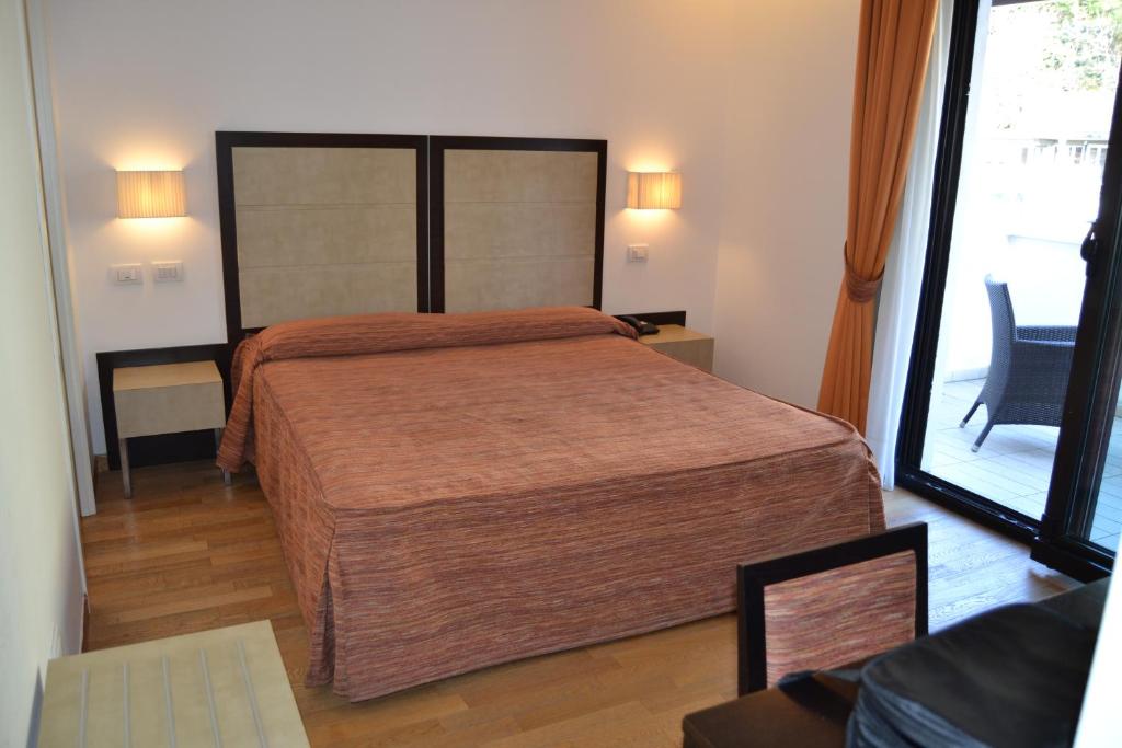 Postel nebo postele na pokoji v ubytování Hotel Joli