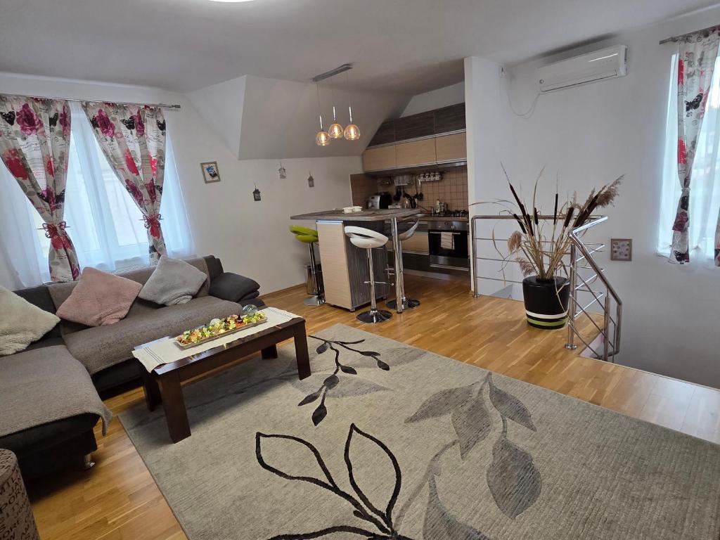 a living room with a couch and a table at Smiley Apartment in Sibiu