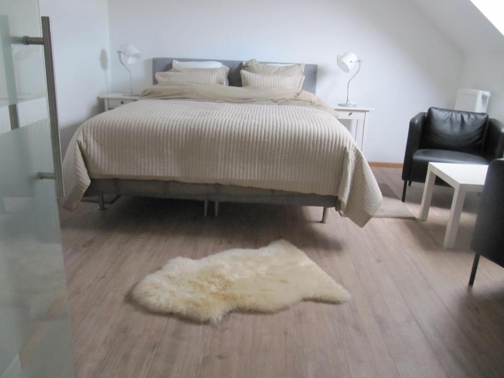 Postel nebo postele na pokoji v ubytování B&B Bodegem