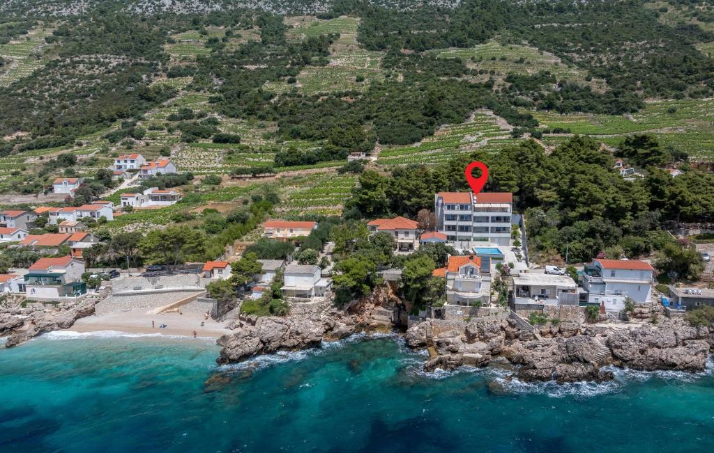 an aerial view of a beach with a red marker at Cozy Apartment In Potomje With Lake View in Potomje