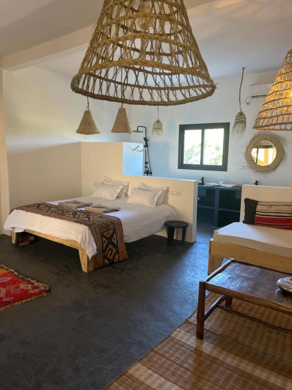 Postel nebo postele na pokoji v ubytování Kalao beach