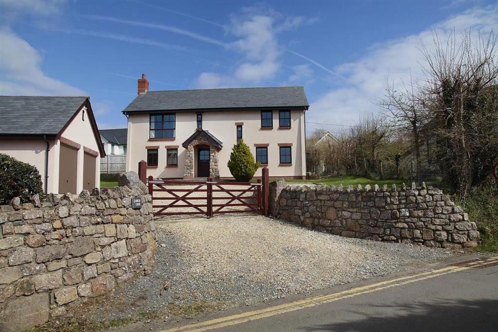 een wit huis met een hek en een stenen muur bij 4 Bed in Gower oc-hh151 in Llangennith