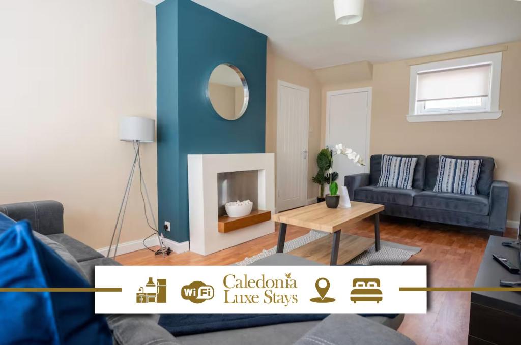 a living room with a couch and a fireplace at 2 BDR House By Caledonia Luxe Stays Short Lets & Serviced Accommodation Bathgate in Bathgate