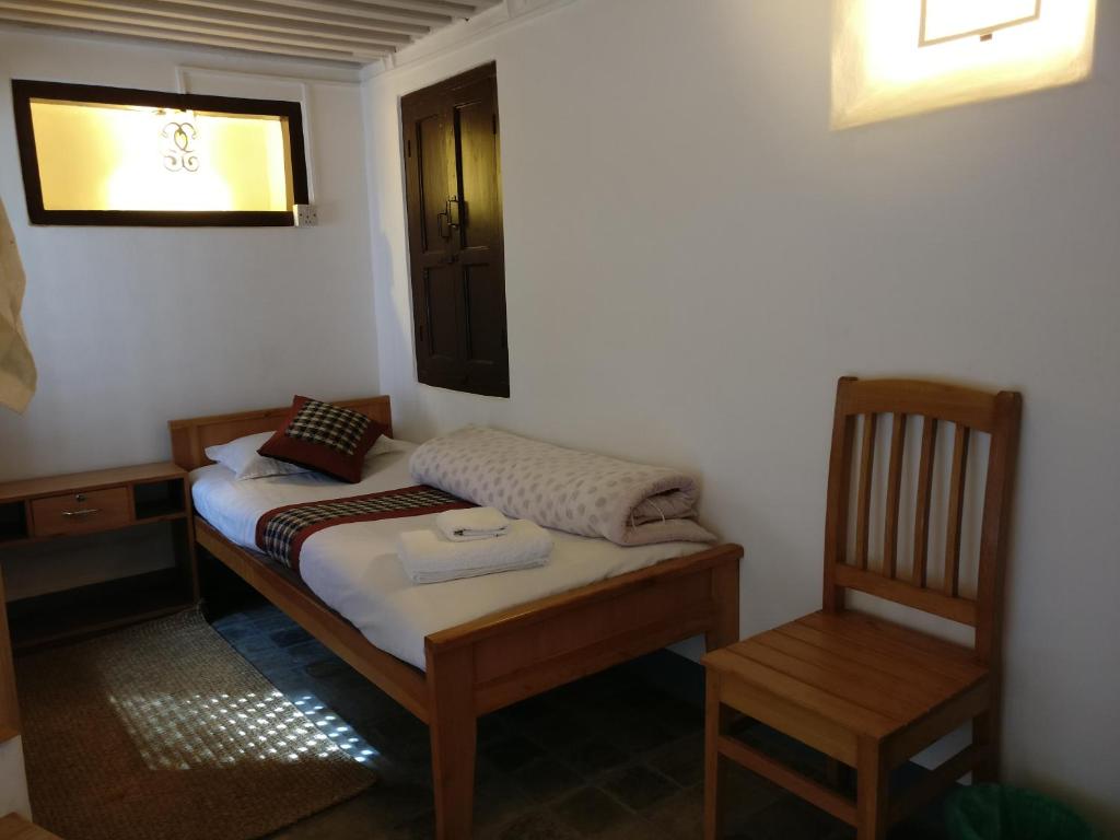 Postel nebo postele na pokoji v ubytování Hiranya Guest House