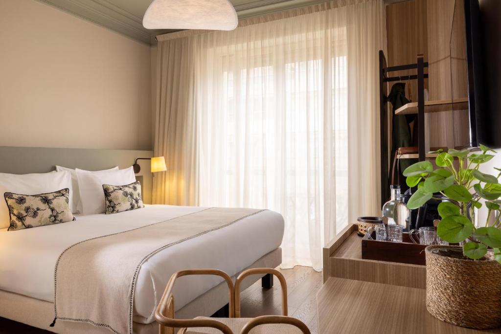 En eller flere senge i et værelse på Crisol Mozart