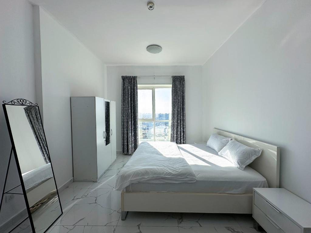 Postel nebo postele na pokoji v ubytování Entire -1 Bedroom Apartment In Oasis Tower