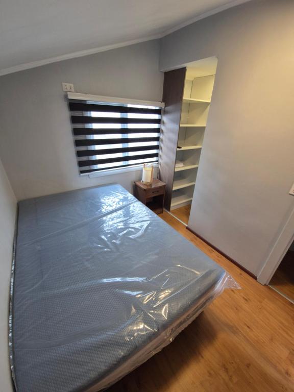 En eller flere senge i et værelse på Cabañas Friburgo