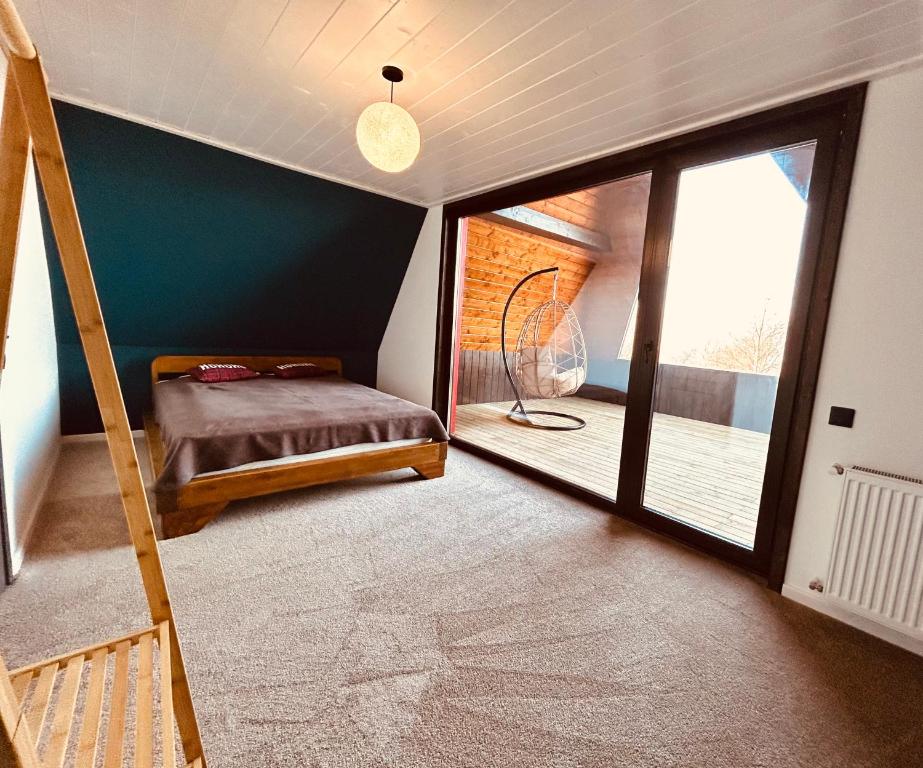 En eller flere senge i et værelse på Casa Aproape de Stele din Beliș, Apuseni