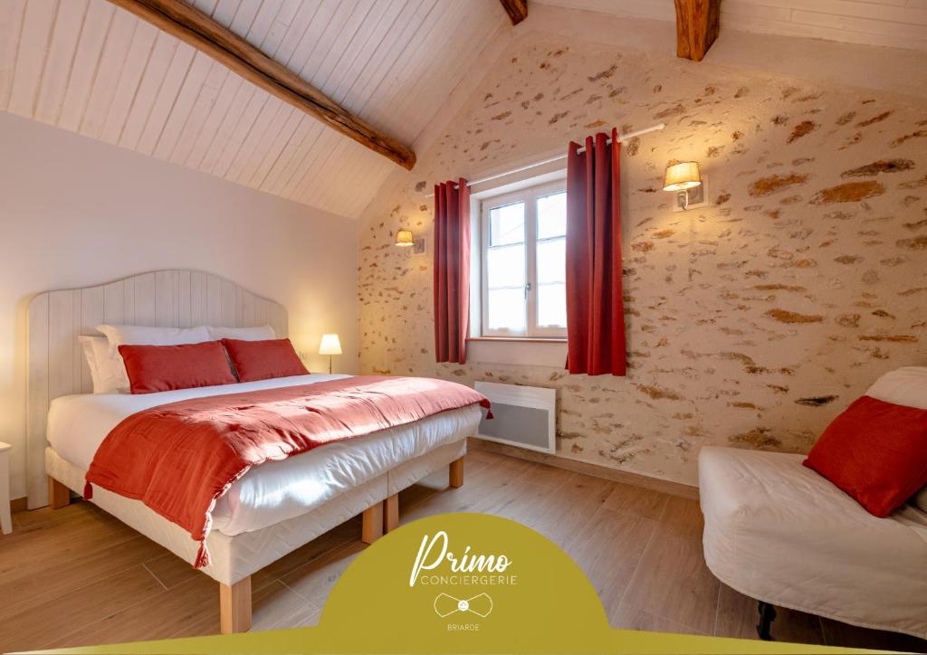 En eller flere senge i et værelse på La Blandynette - rénové et authentique - 3P