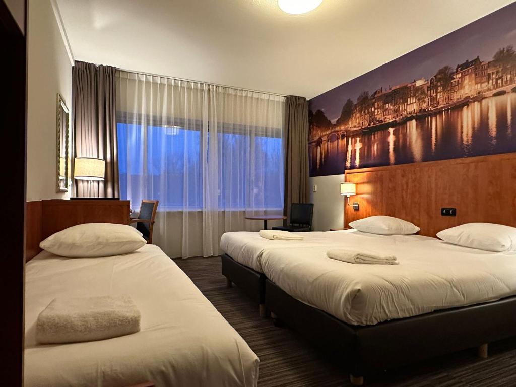 Ένα ή περισσότερα κρεβάτια σε δωμάτιο στο Westlake Hotels Amsterdam