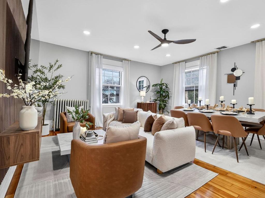a living room with a couch and a table at The Harvard Loft with Game Room and Free Parking Near Harvard Square in Cambridge