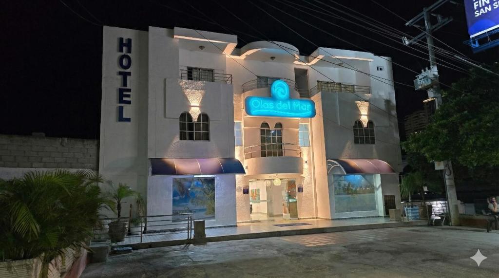 a building with a sign on the front of it at Olas del Mar Hotel by GHO Hoteles in Santa Marta