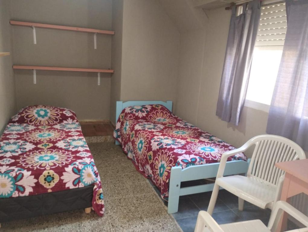 En eller flere senge i et værelse på Hotel Z Los Tilos