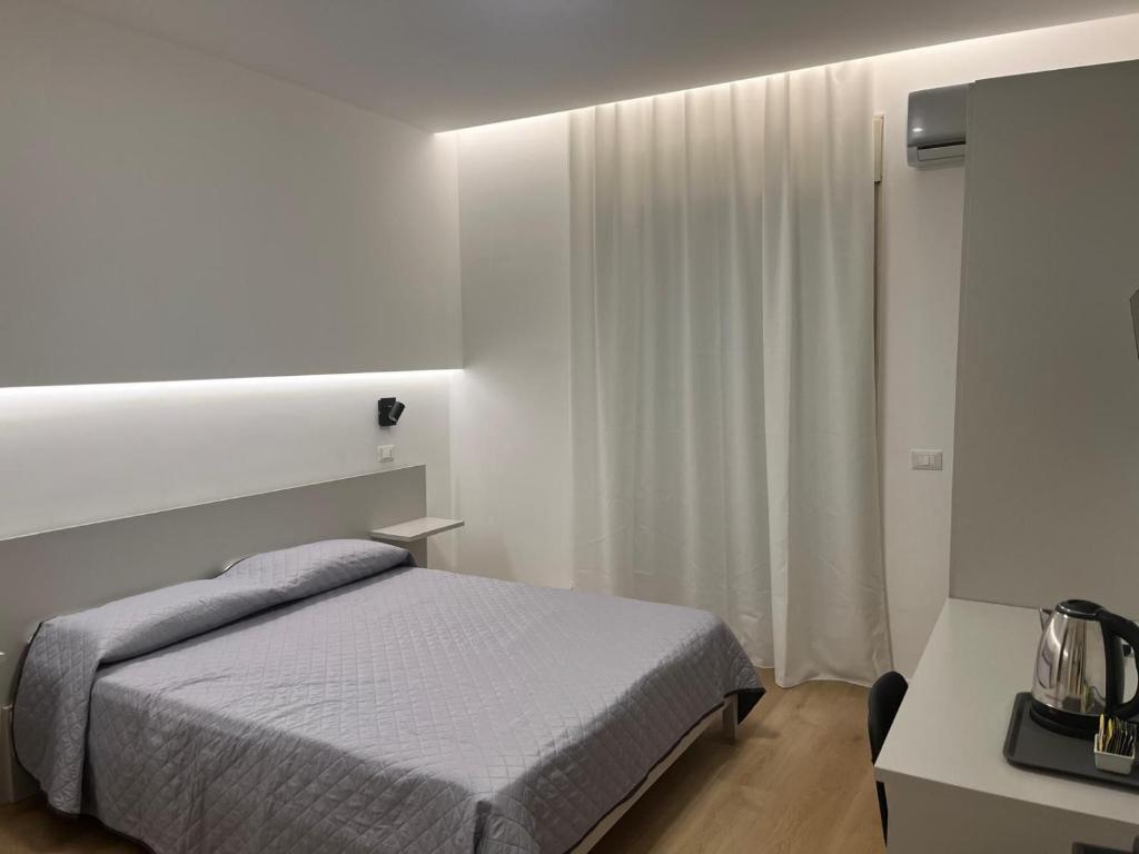 En eller flere senge i et værelse på Lungomare Vazzana