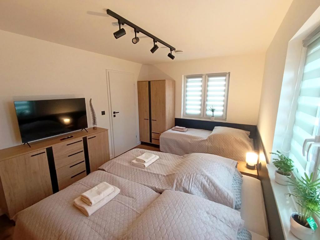 Postel nebo postele na pokoji v ubytování Apartament Chyża