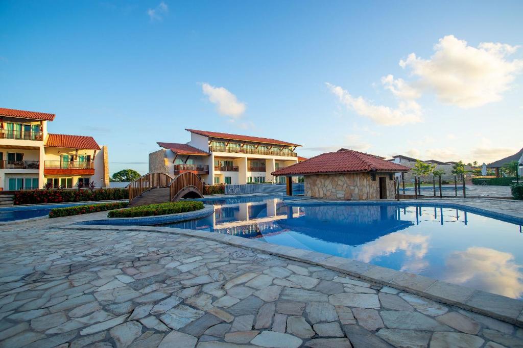 Bazén v ubytování Chalé de Luxo no Meridional Club Praia dos Carneiros nebo v jeho okolí