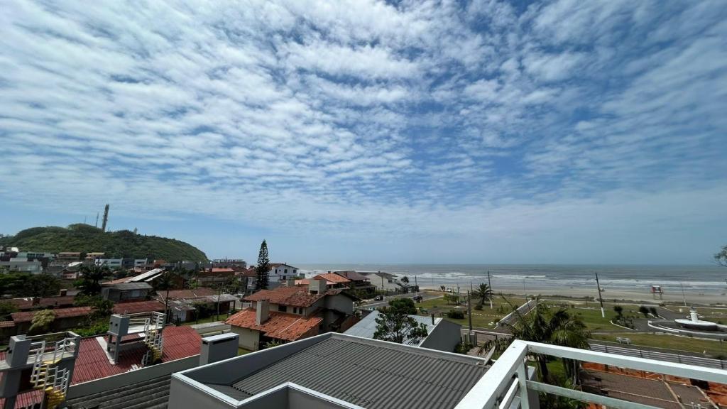 a view of the beach from a balcony of a city at Residencial Da Cal in Torres