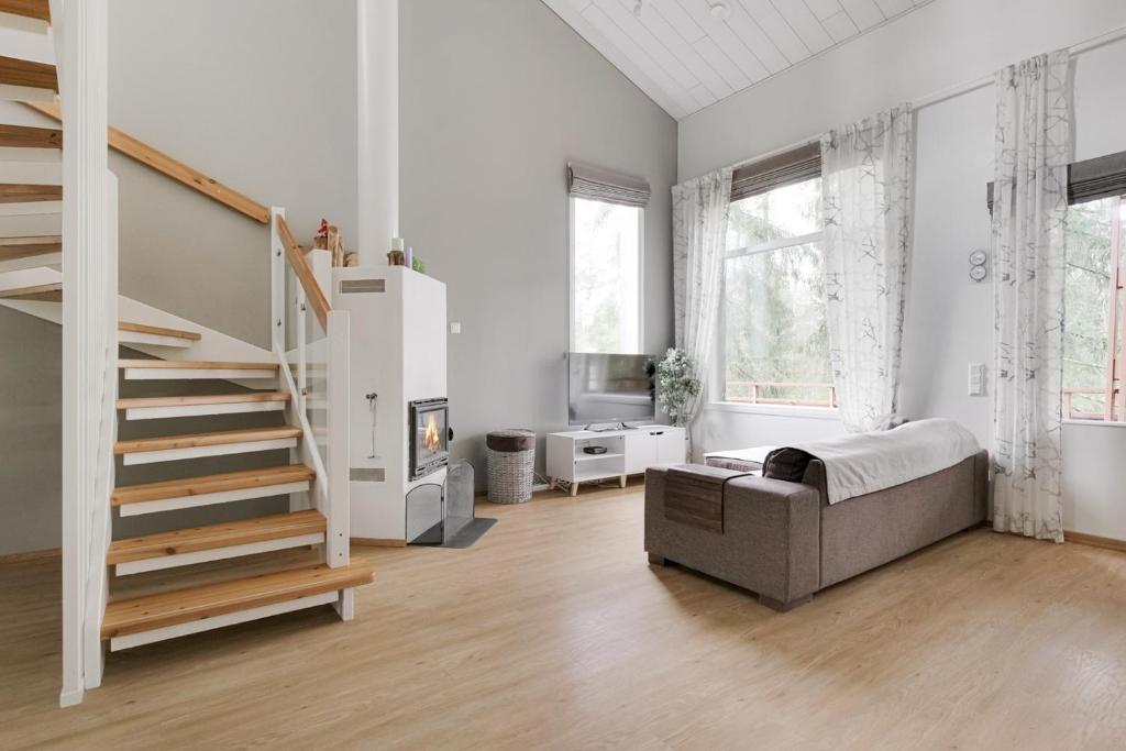 Giường trong phòng chung tại Imatra SPA VILLAS