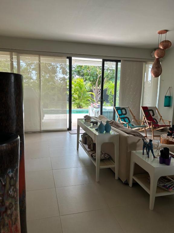 a living room with a couch and a table at Ideal home to relax and enjoy with family in El Nance