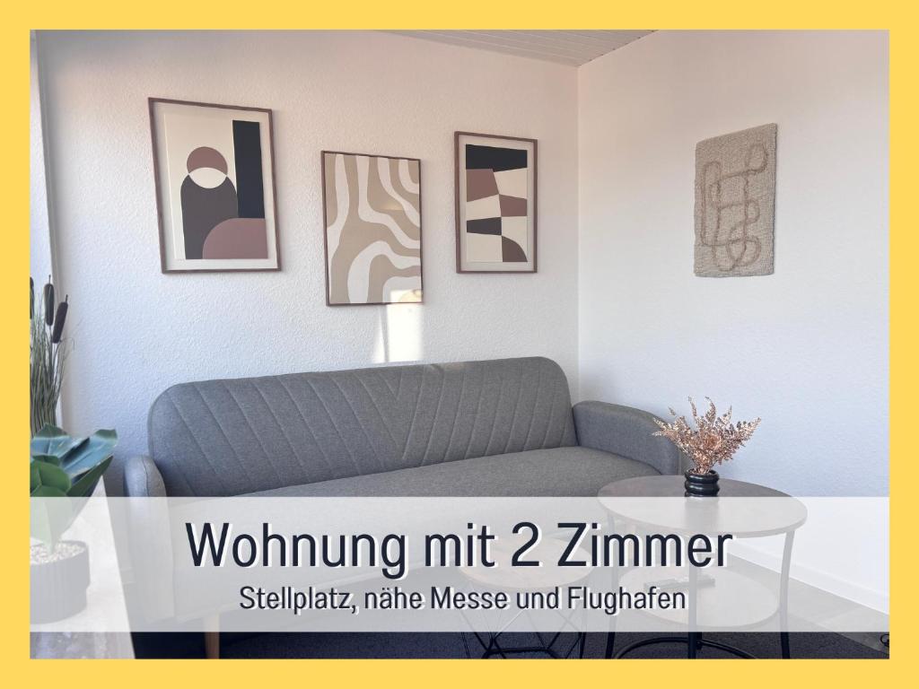 a living room with a couch and a table at Casa Viola Filderstadt, 2 Zimmer, komplett renoviert, top für Familien und Geschäftsreisen, super ausgestattet, PKW Stellplatz in Filderstadt