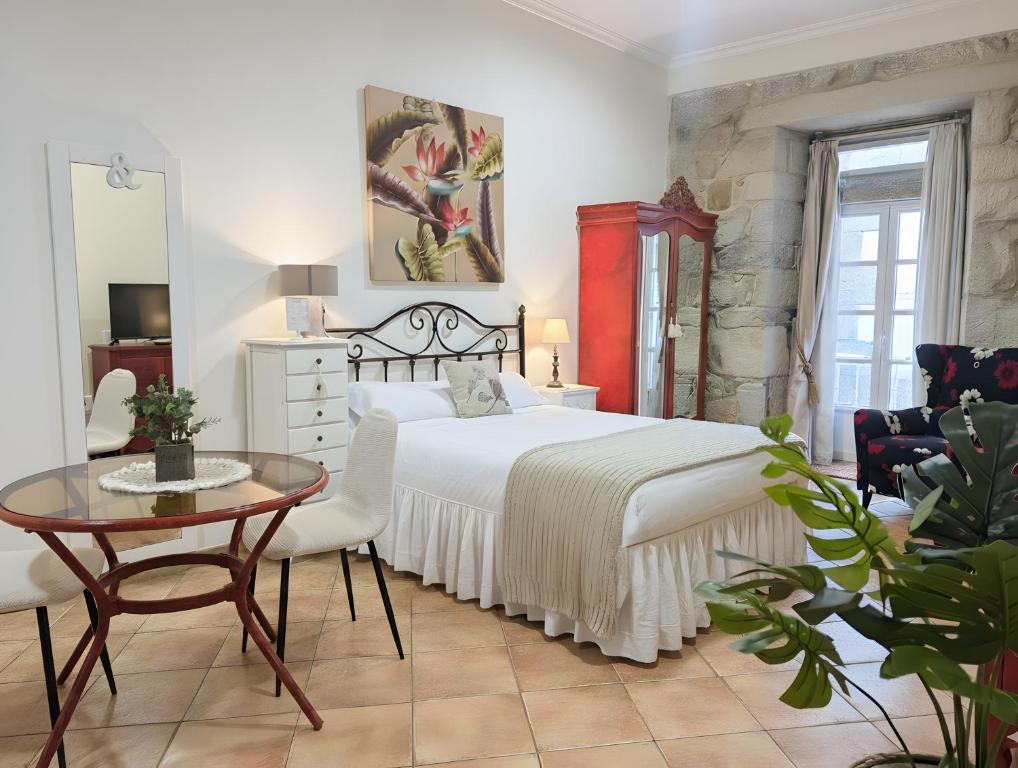 En eller flere senge i et værelse på Holibai, Vermello, Un rincón con encanto cerca de la playa