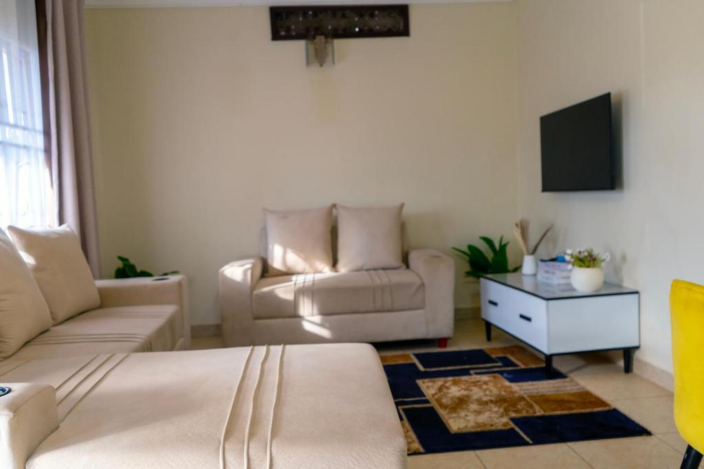 Posezení v ubytování Modern Oasis 5 Mins to Acacia Mall CJs and Padel