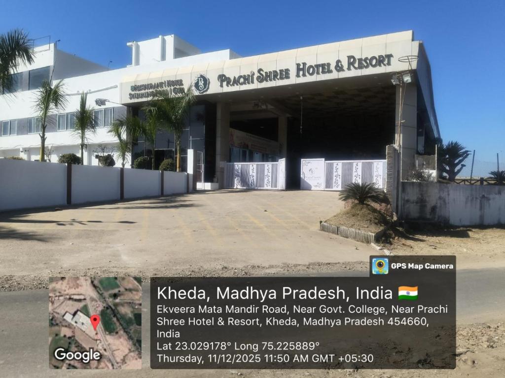 a building with a sign in front of it at Prachi Shree Hotel and Resort in Badnāwar