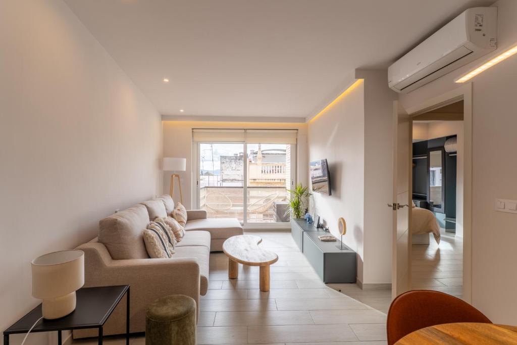 a living room with a couch and a table at Concepcion Suite in Córdoba