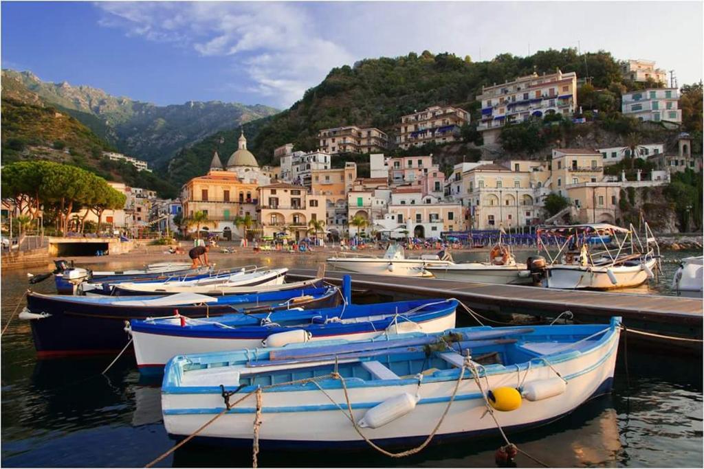 a group of boats docked in a harbor with buildings at La Sorgente B&B in Cetara