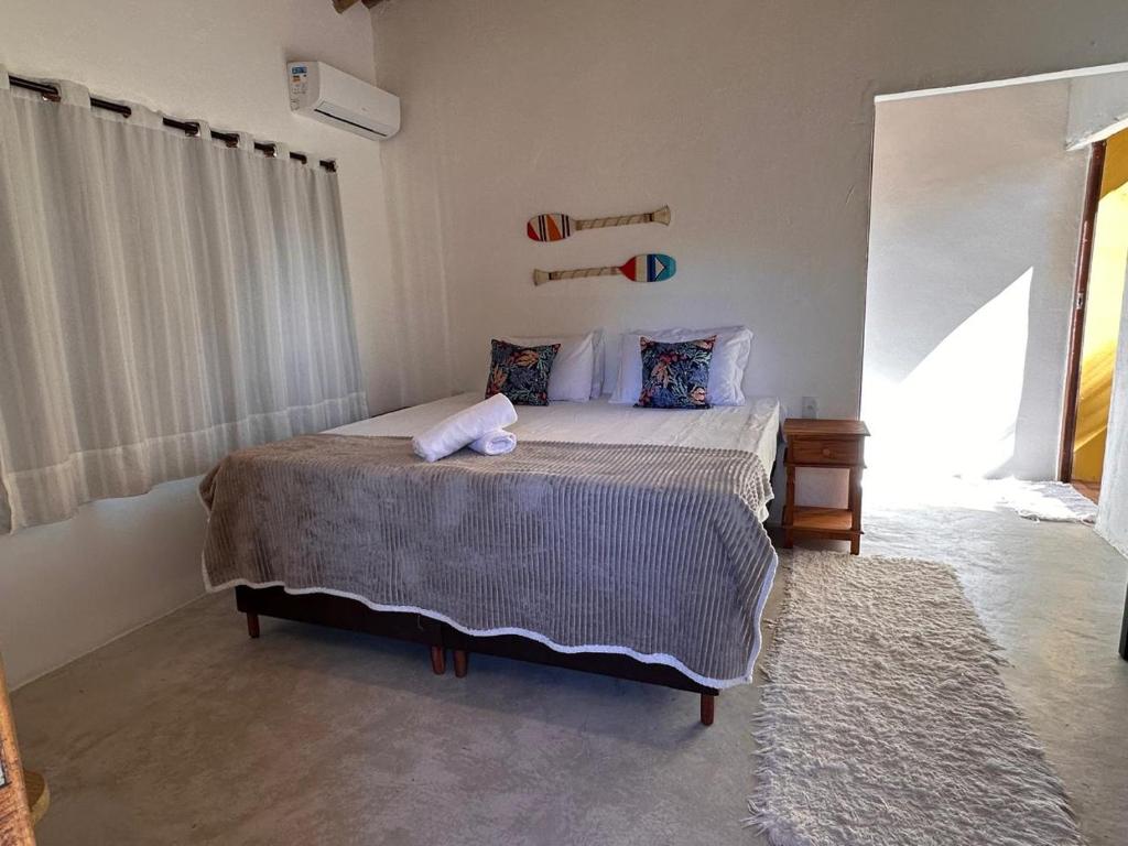 En eller flere senge i et værelse på Villa Beija Flor