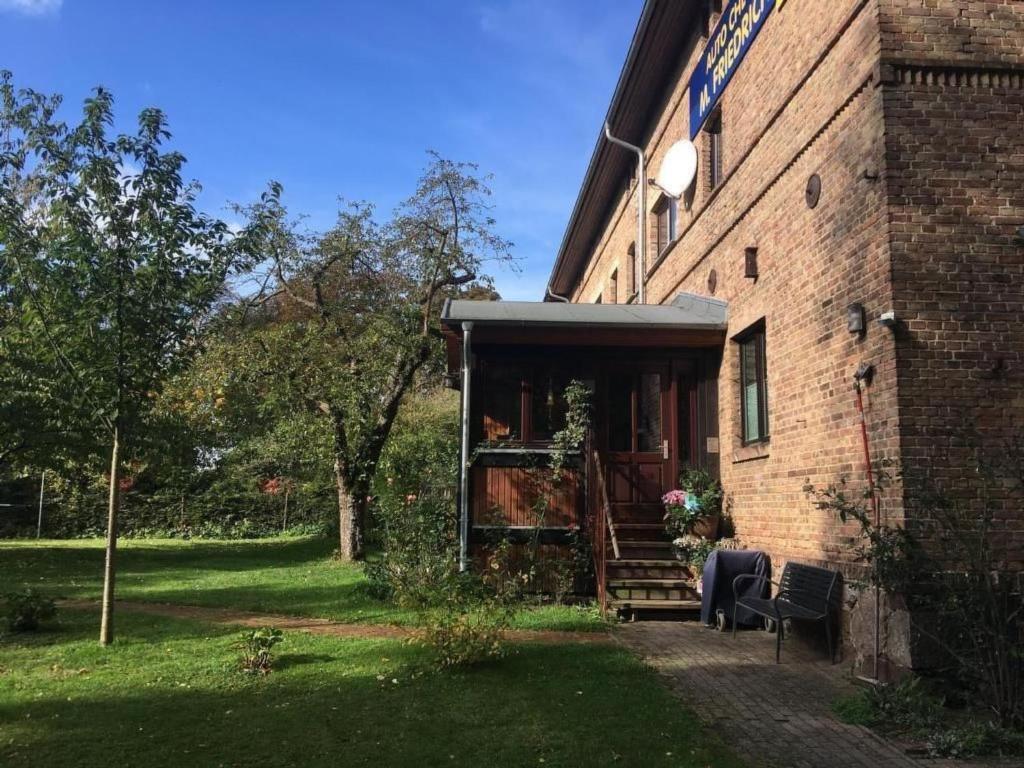 an entrance to a brick building with a porch at Apartment Kastanienblick by Interhome in Ziethen