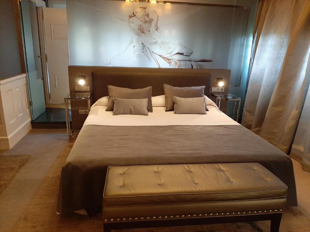 En eller flere senge i et værelse på Hotel Castillo el Collado