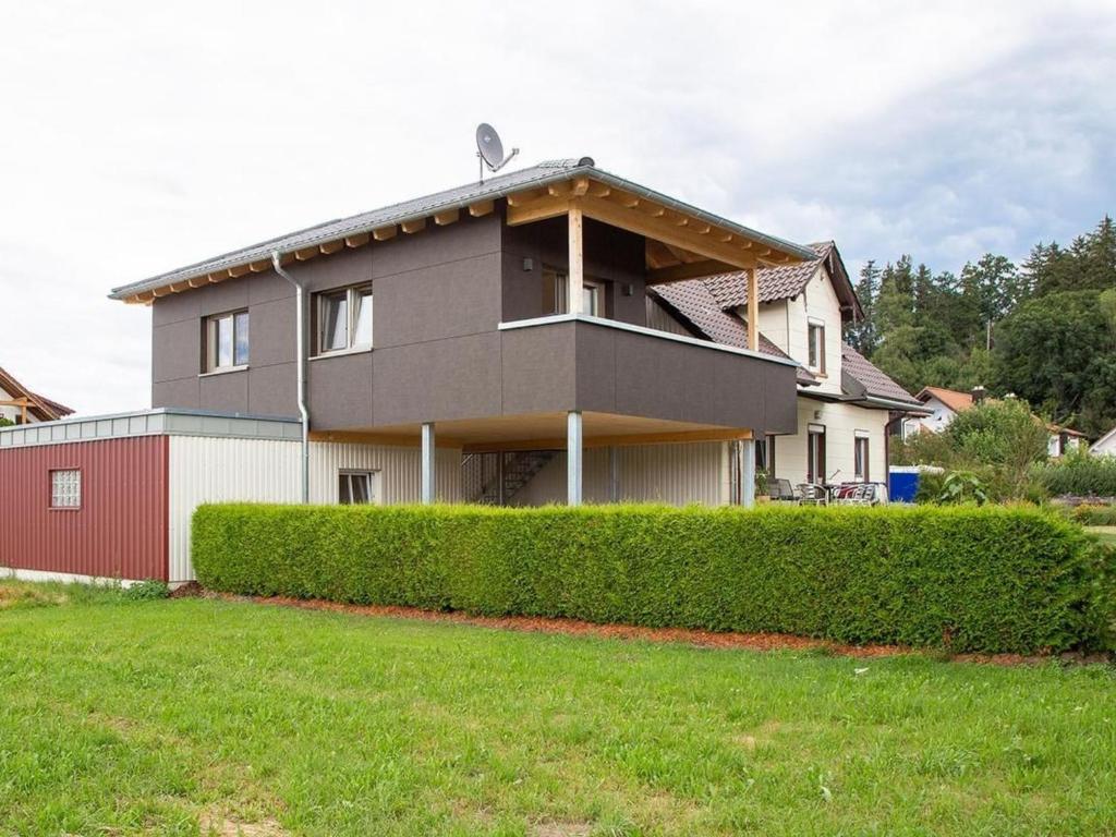 a house with a hedge in front of it at Apartment im Illertal by Interhome in Altenstadt