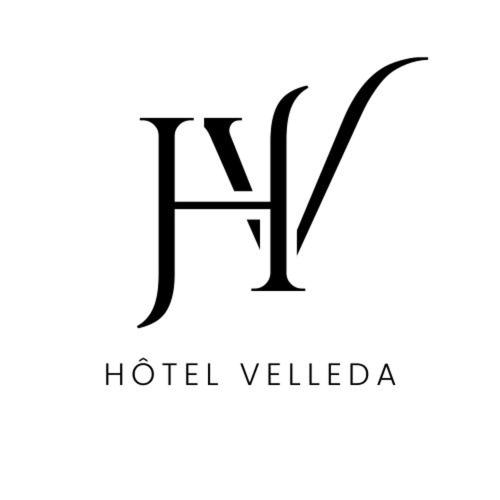 ein schwarz-weißes Logo für ein Hotel namens La in der Unterkunft HOTEL VELLEDA in Rabat