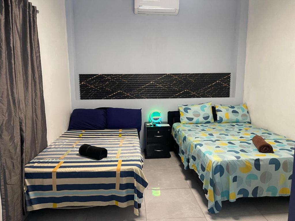 Postel nebo postele na pokoji v ubytování Evolution Home