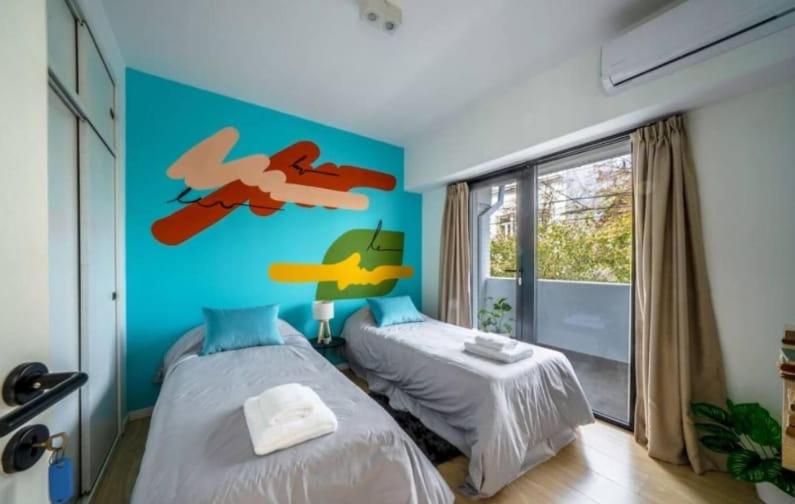 En eller flere senge i et værelse på MOT Serrano 1000 Palermo Soho